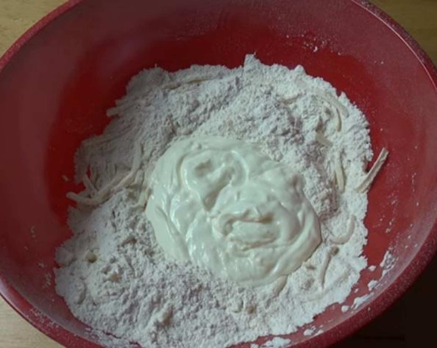 step 1 Inside a mixing bowl, mix together your Self-Rising Flour (2 cups), Cheese (1/2 cup), and Salt (1 pinch). Add the Natural Unflavored Yogurt (1/4 cup) and mix until a nice and smooth dough forms.