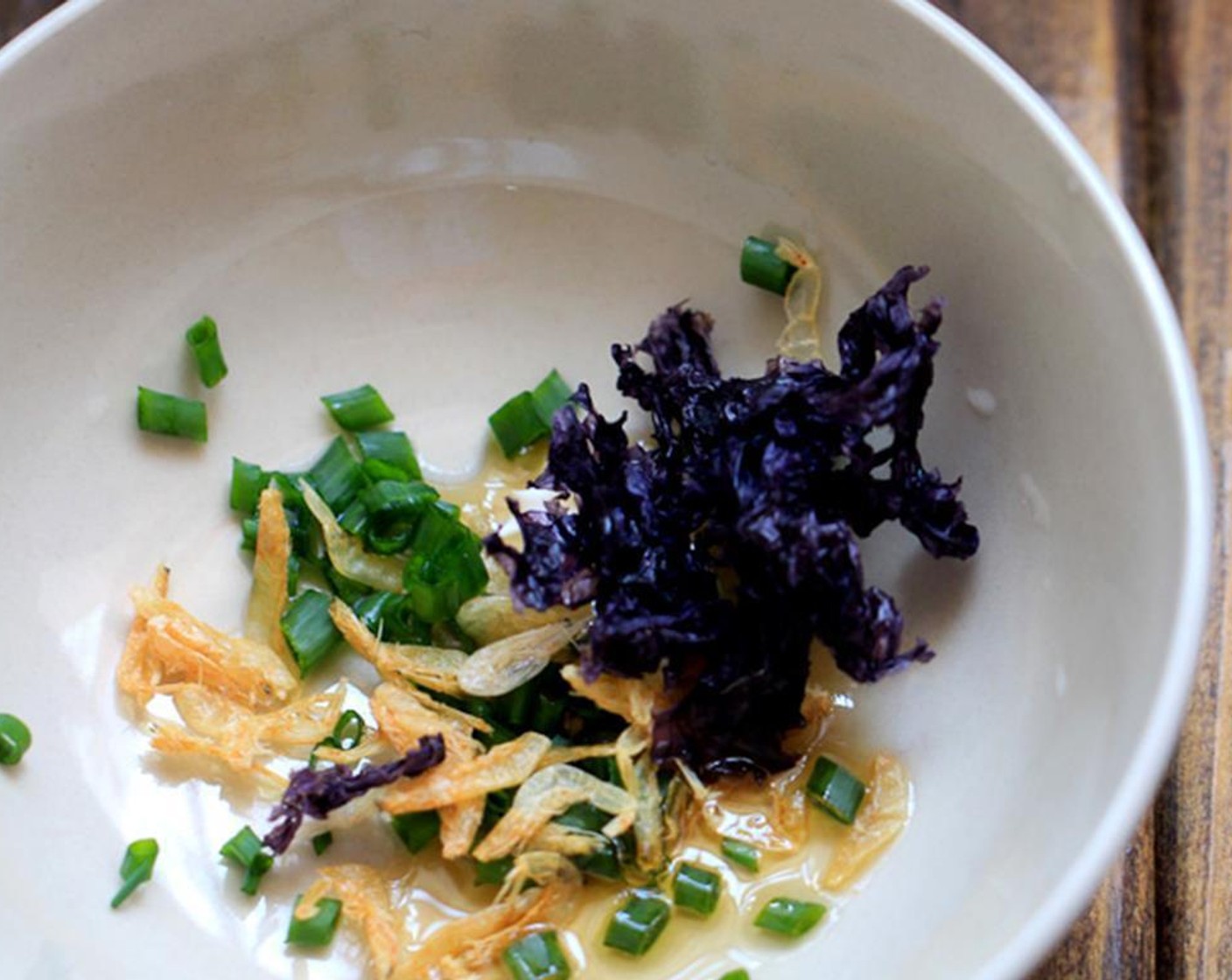 step 5 In a serving bowl, mix Dried Shrimp (1 tsp), Sesame Oil (1 tsp), chopped Scallions (to taste), Dried Seaweed (1 piece) and Salt (to taste). Set aside.