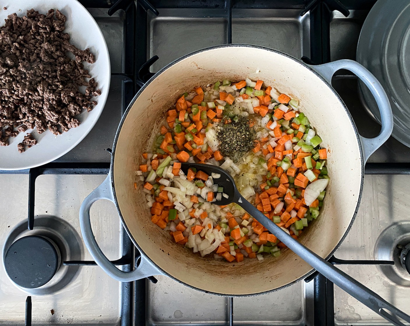 step 4 Add the Salted Butter (4 Tbsp) and heat until melted. Stir in the onion, celery, carrot, garlic, Dried Mixed Herbs (1 Tbsp), Salt (to taste), and Ground White Pepper (1 pinch) and sauté over low heat until softened and fragrant.