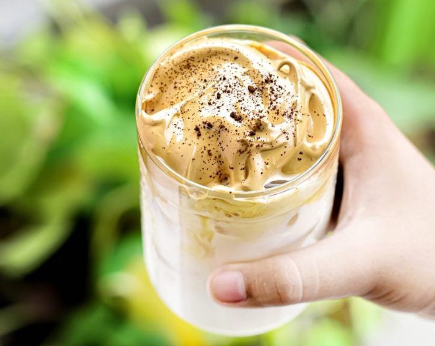 step 3 Spoon the foam onto the milk in the cup. Sprinkle some cocoa powder as garnish if desired. Mix it with a spoon to make a latte, or just enjoy it with a little foam and milk all in one sip!