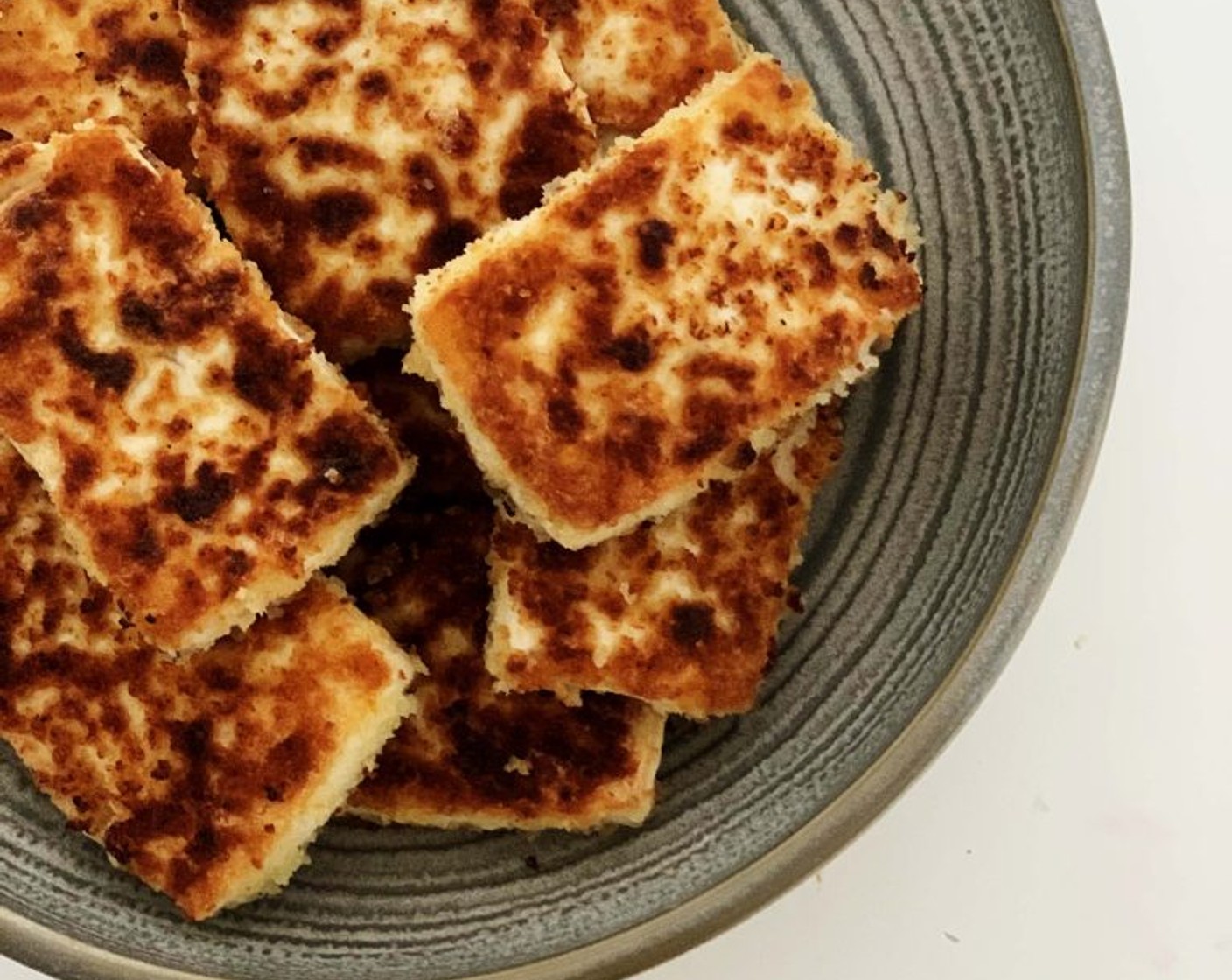 step 5 Transfer the Tofu onto a paper towel-lined plate to drain excess oil. Serve the Tofu warm.