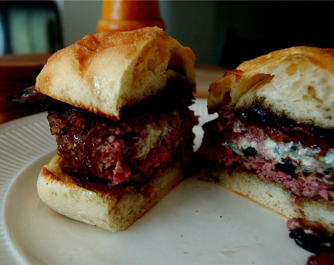 step 3 Toast and butter the Bread Roll (1). Place the burger on the bun and top with a generous spoon of Just Jan’s® Pomegranate Fruit Spread (to taste) and a piece of bacon.