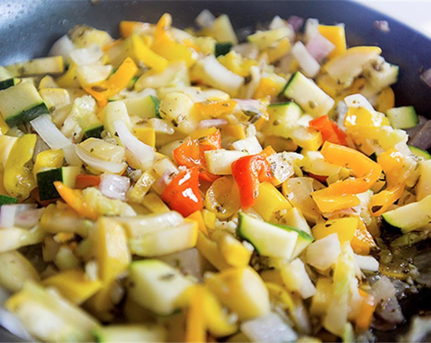 step 3 Add squash, peppers, onion, oregano, Salt (1/4 tsp), Ground Black Pepper (1/8 tsp), and minced garlic. Cover and cook until veggies are tender.