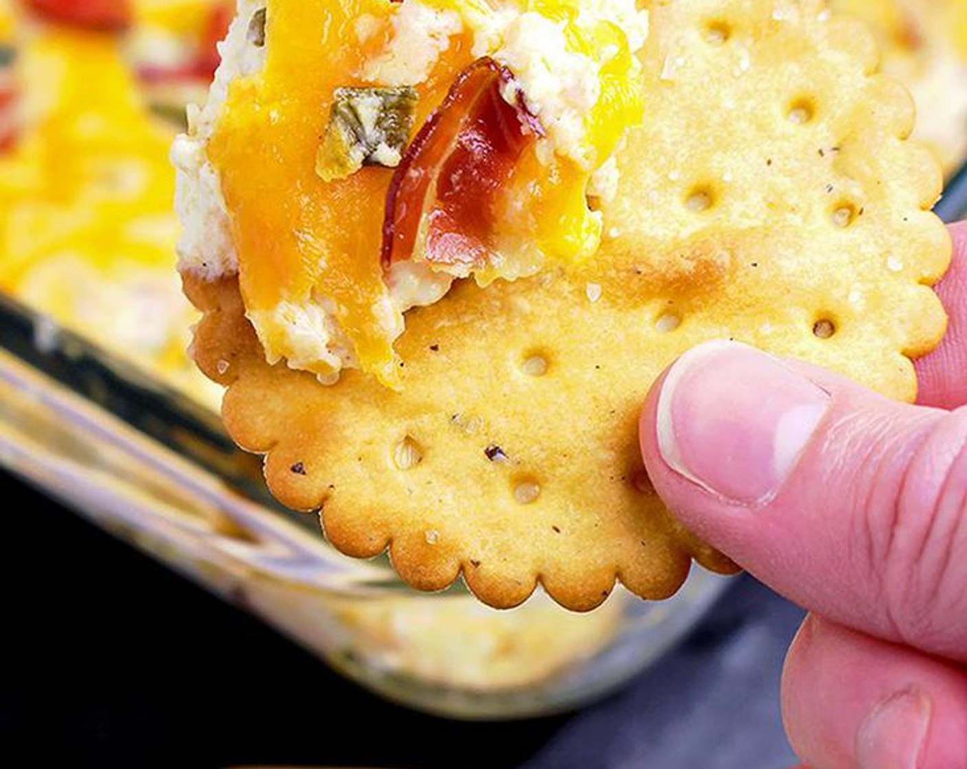 step 3 Add Shredded Cheddar Cheese (1 1/4 cups), Cooked Bacon (8 oz), Cherry Tomatoes (4), Scallion (1/2 cup), Garlic (1 clove), Paprika (1/4 tsp) and Ground Black Pepper (1/4 tsp). Stir well and put in a baking pan.