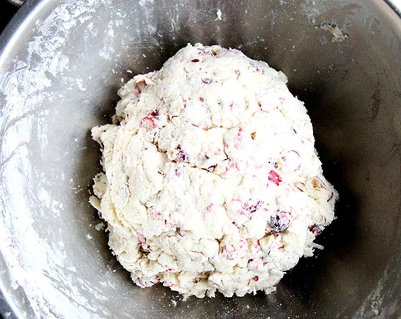 step 4 Use a pastry blender or the back of a fork to cut the butter into the dry ingredients. When you are finished, the butter should be dispersed throughout the flour in pea-sized lumps. Add Buttermilk (1 1/2 cups). Mix gently with a wooden spoon until the dough holds together.