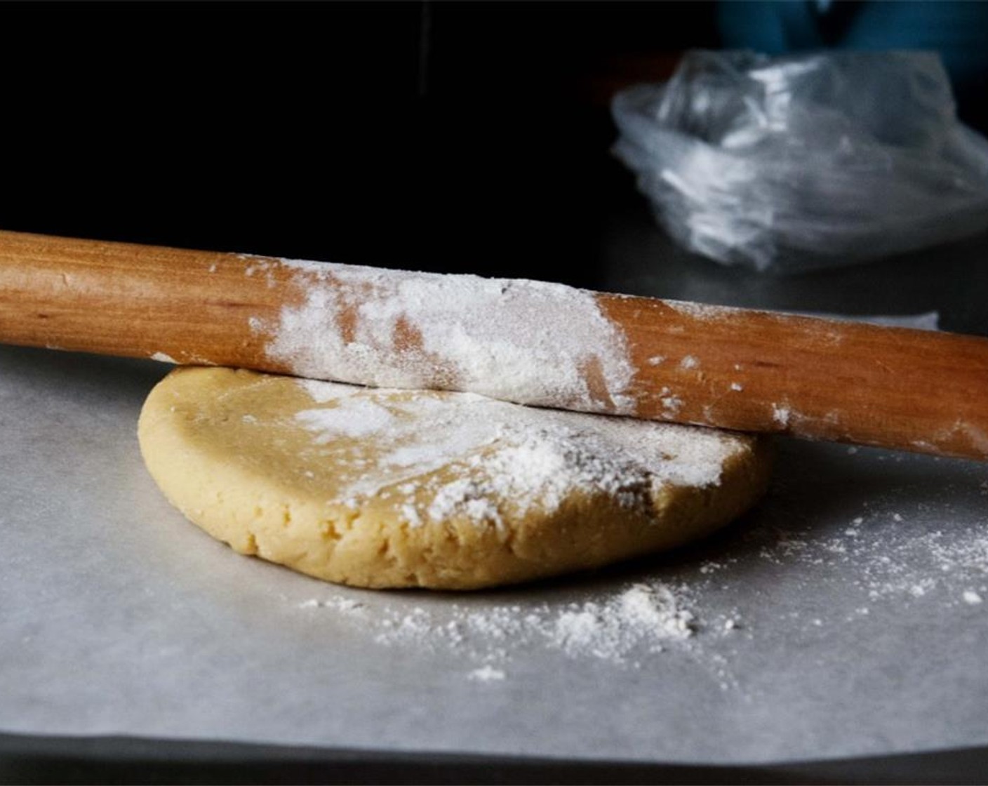 step 8 Preheat the oven to 180 degrees C (350 degrees F). Dust your kitchen counter and rolling pin with flour, and gently roll out the dough into a circle, about 3mm thick.