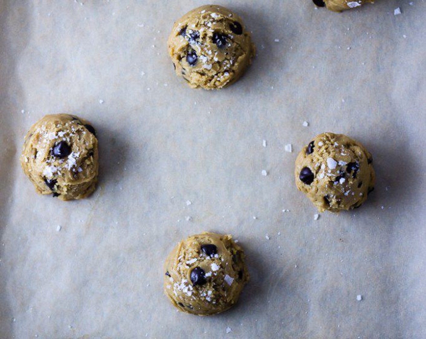 step 7 Remove cookie sheets from freezer and sprinkle each cookie mound with Sea Salt Flakes (to taste). Bake for 13 minutes.