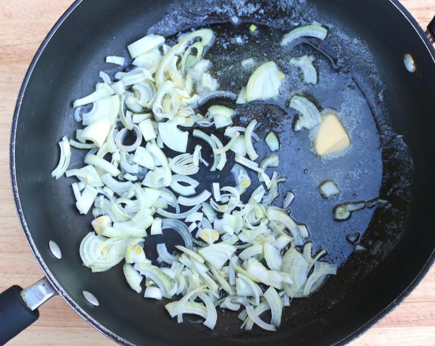 step 1 Saute Onion (1) cut into julienne in Butter (1/4 cup) until translucent.