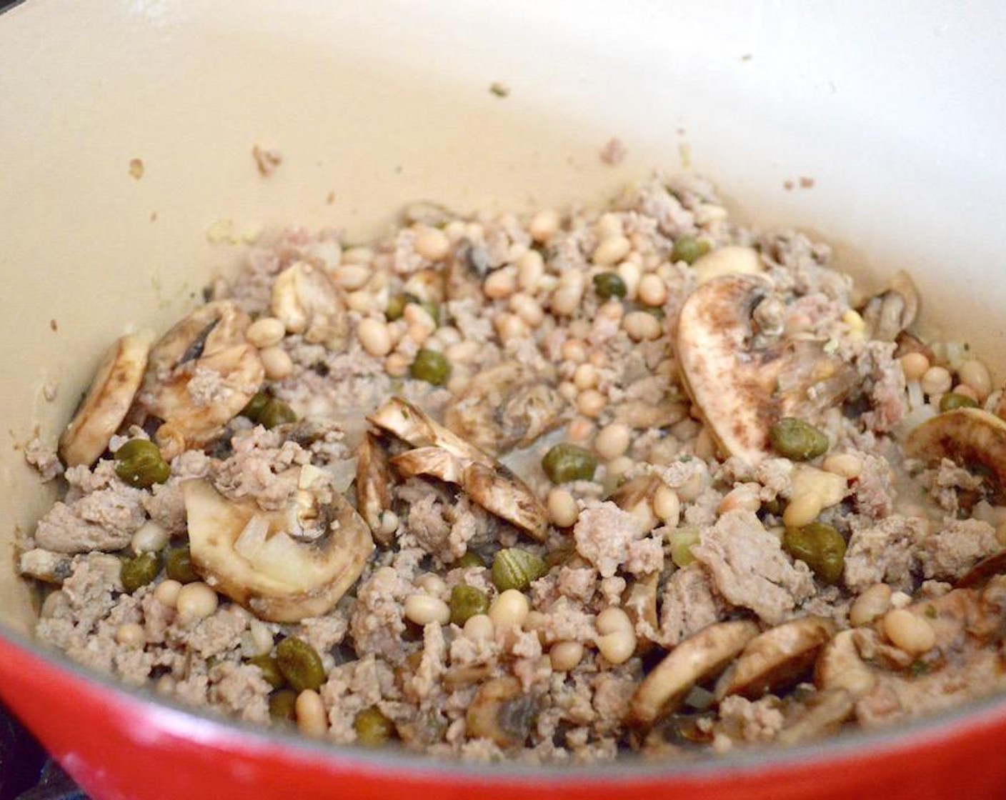 step 1 Heat the Olive Oil (1 dash) in a large dutch oven or stock pot over medium-high heat. Add the White Mushrooms (2 1/3 cups), Onion (1), and Garlic (3 cloves) and let them soften for a couple of minutes.