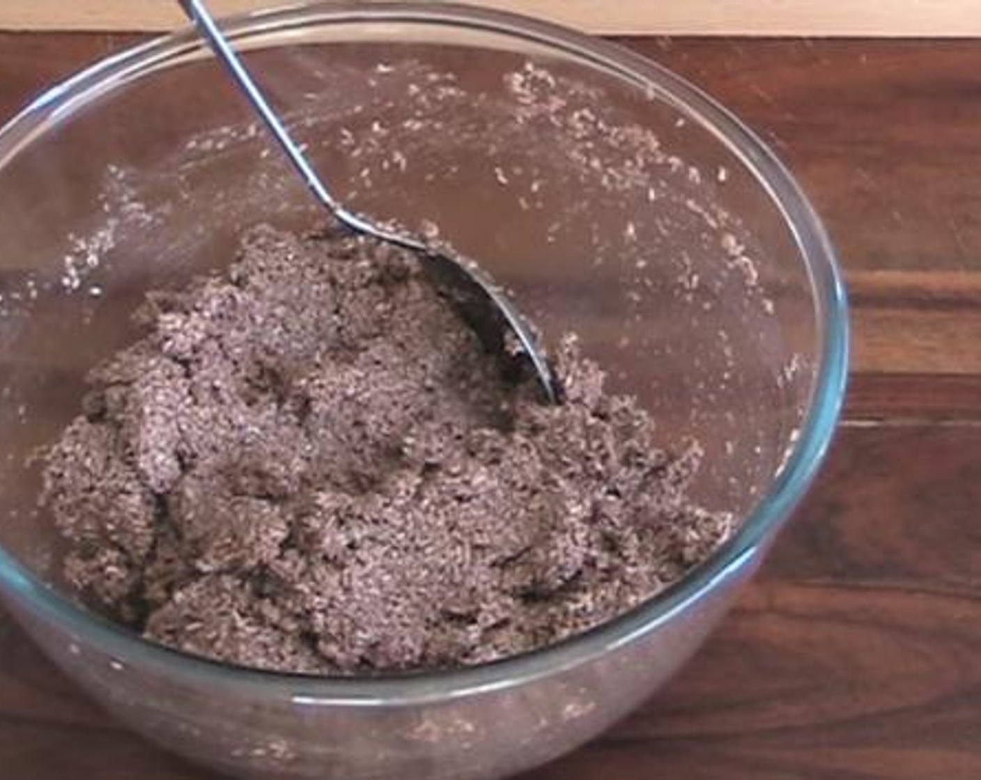 step 1 Into a mixing bowl, add and mix the Desiccated Coconut (2 cups), Caster Sugar (1/2 cup), and Unsweetened Cocoa Powder (1/2 Tbsp). Then add in the Eggs (2) and Milk (1/4 cup). Combine everything together.