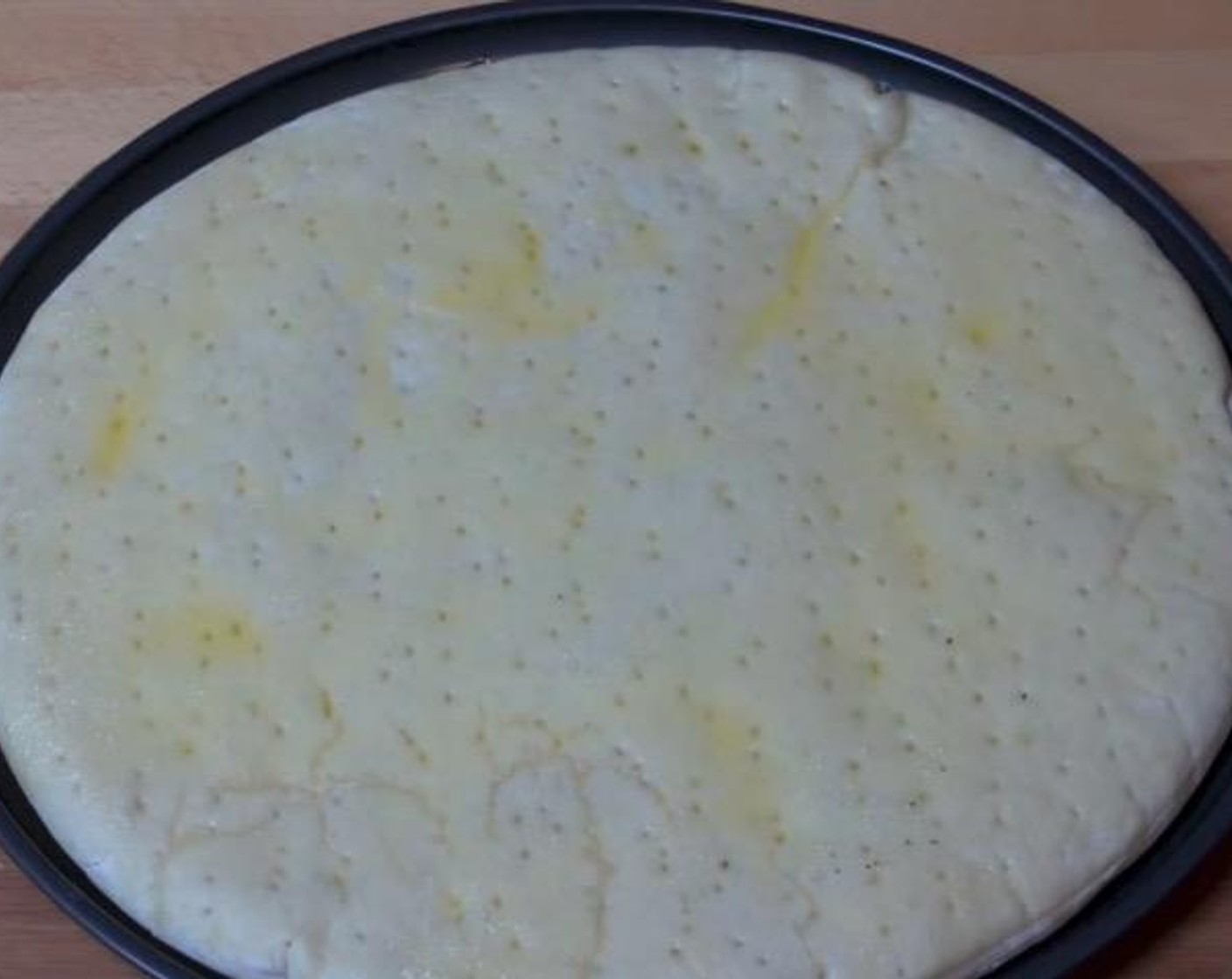 step 1 Brush Large Pizza Dough (1) with Butter (0.5 oz). Bake at 230 degrees C (450 degrees F) for 5 minutes.