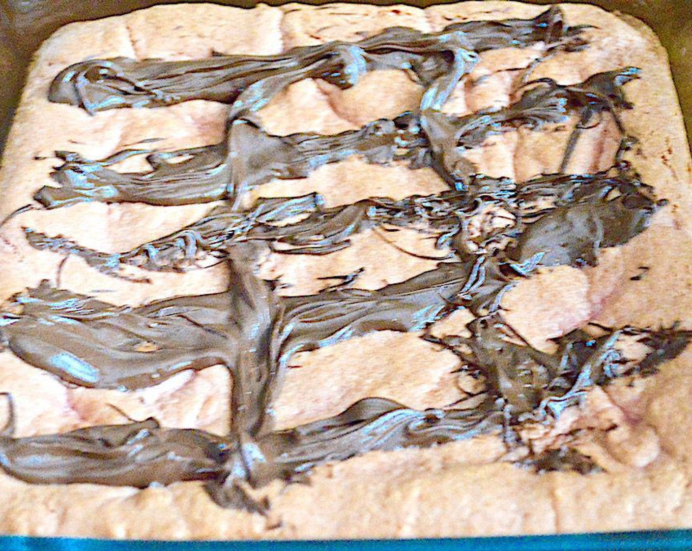 step 6 Drizzle the melted chocolate over the cooled brownies in thick stripes.