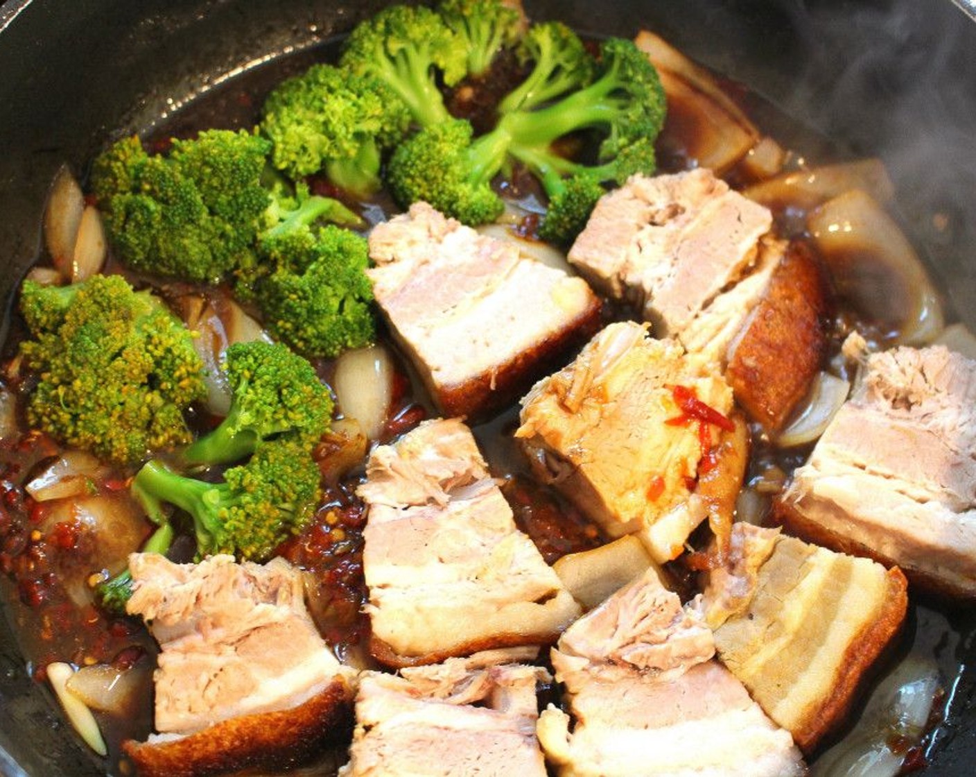 step 10 Add in pork belly and Broccoli Florets (2 cups). Simmer for 2 minutes while spooning the sauce over the meat and vegetables.