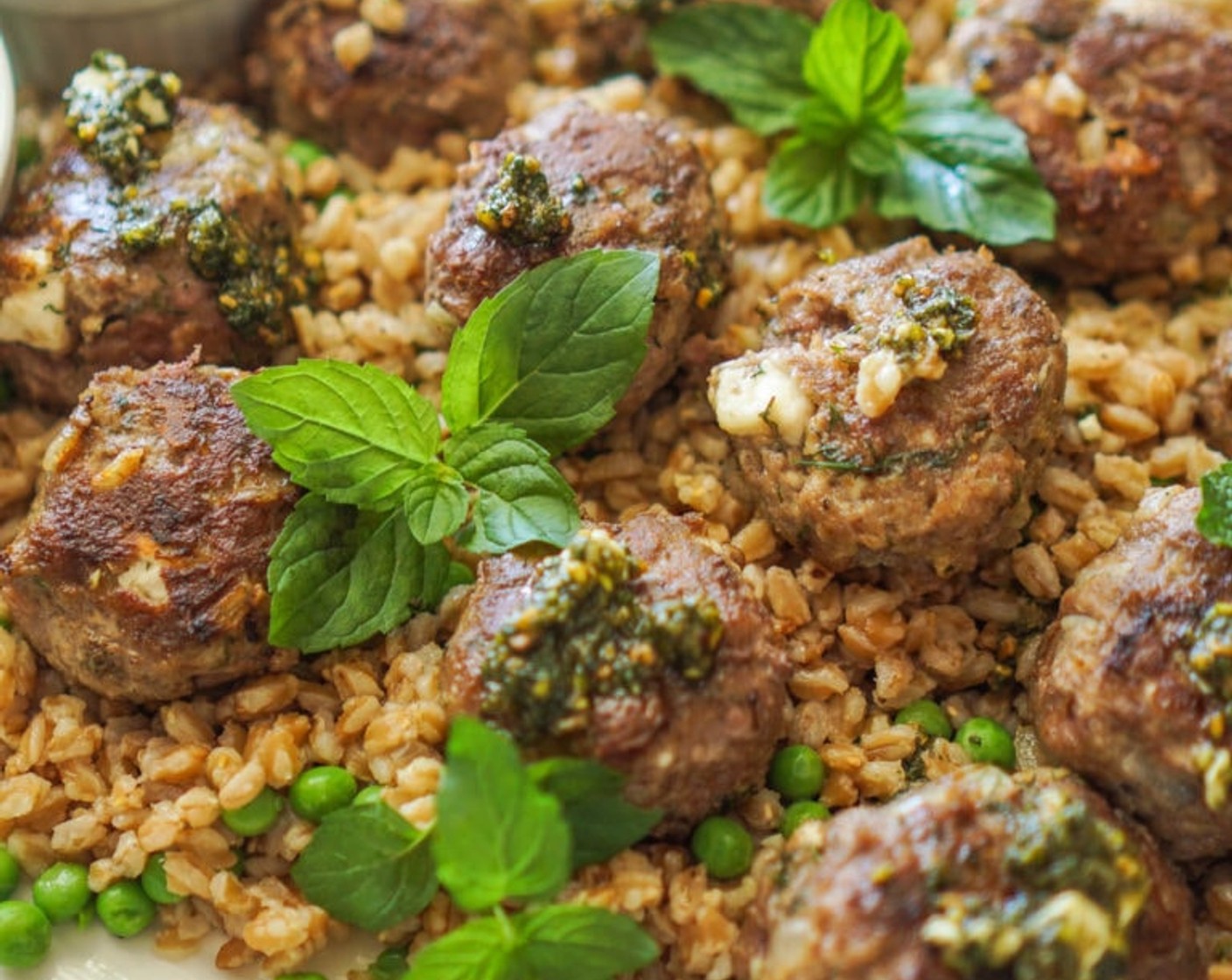 step 10 To serve, arrange the farro on a large serving platter. Cover with the meatballs and some fresh Fresh Mint (to taste) (optional). Enjoy!