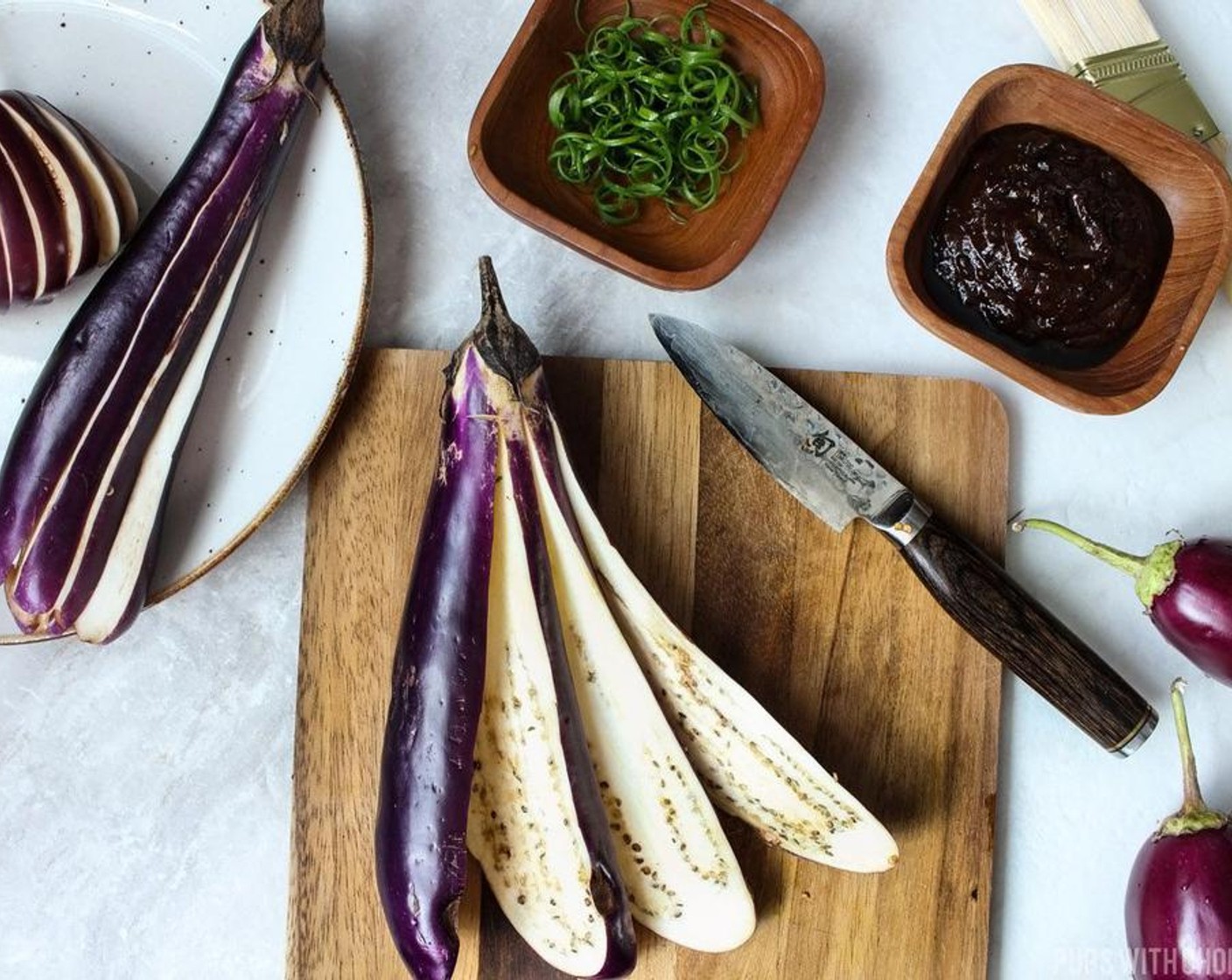 step 3 Lightly rub Canola Oil (as needed) on the skin and between the slits of the eggplant and run your fingers through it so the oil is spread to a thin layer.