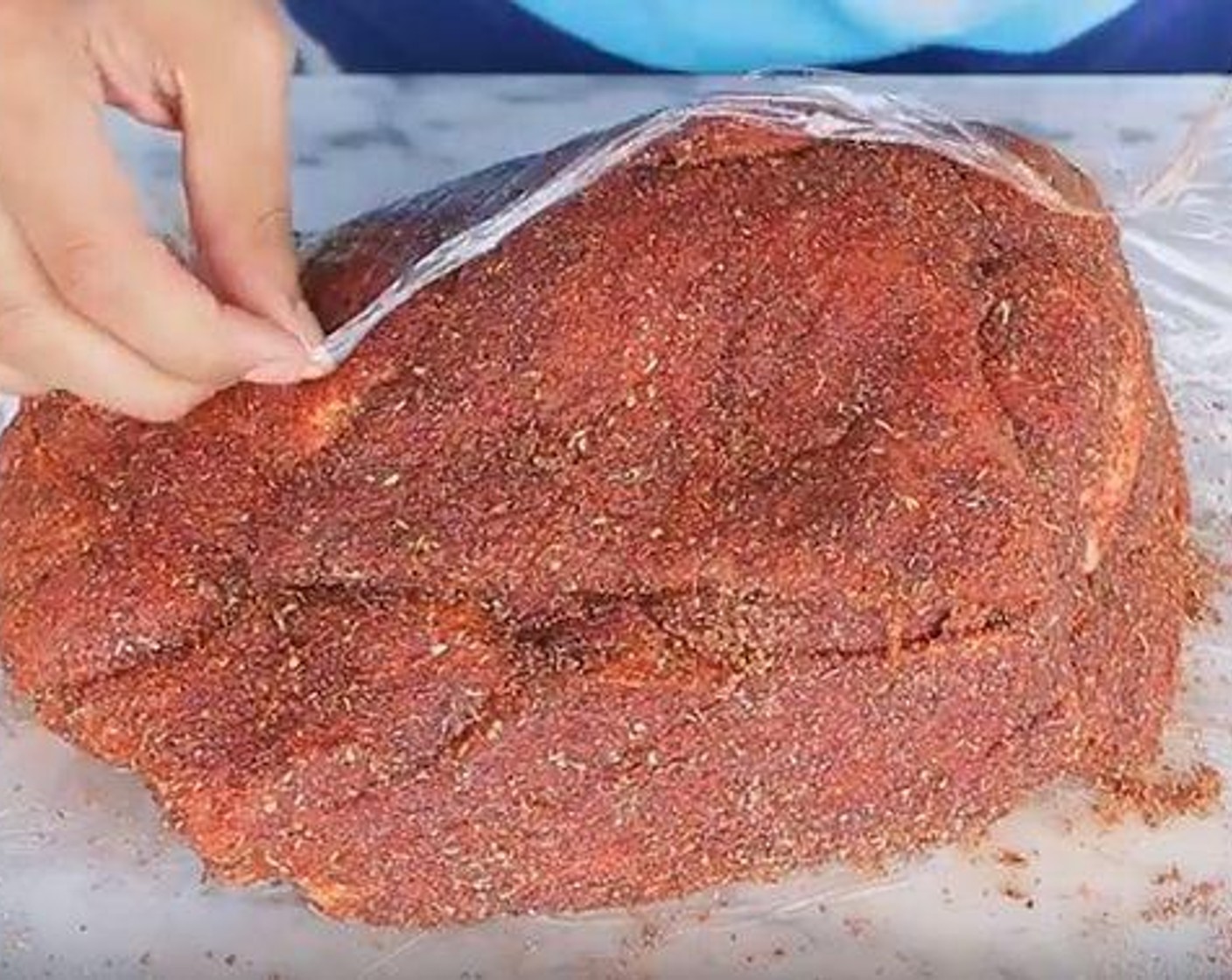 step 2 Rub the mixture all over the Pork Shoulder (7 lb). Wrap the pork in plastic wrap and refrigerate for several hours or overnight.