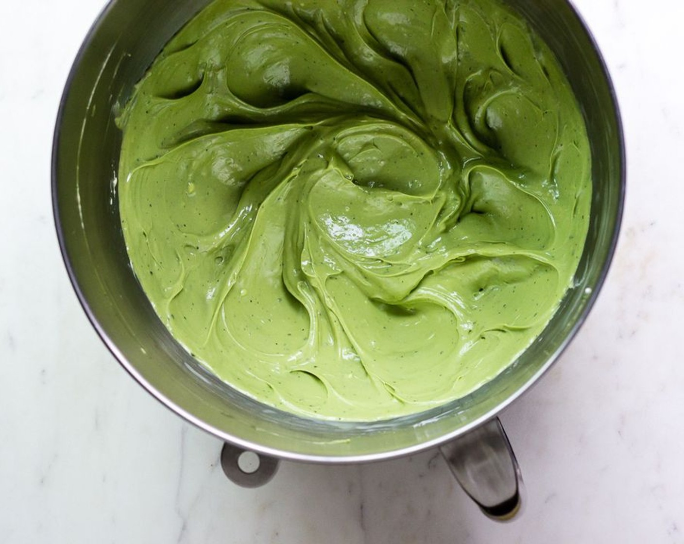step 3 Stop the mixer and sift the Matcha Powder (1 Tbsp) into the cream cheese and beat until fluffy, a few minutes. Add in the White Chocolate (2/3 cup) and Eggland's Best Classic Egg (1), beat until mixture is well combined.
