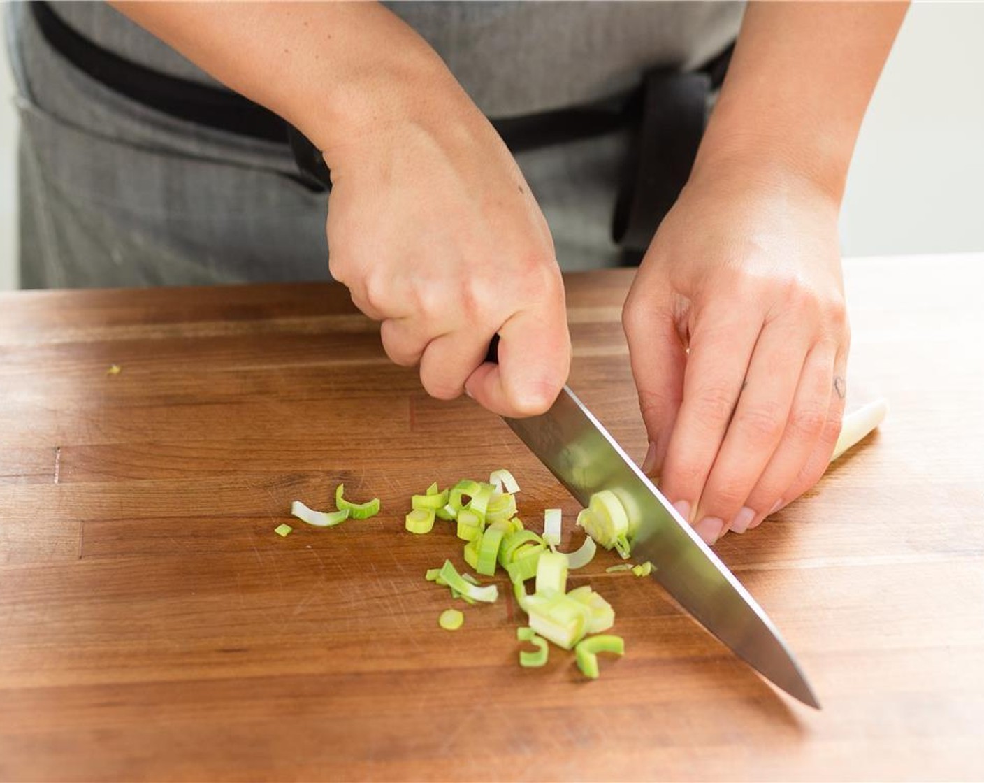 step 4 Meanwhile, cut the Leeks (2 cups) into half inch diced pieces, and set aside. Remove the stems from the Fresh Thyme (3 1/2 Tbsp) and discard stems. Finely chop the thyme leaves and set aside.