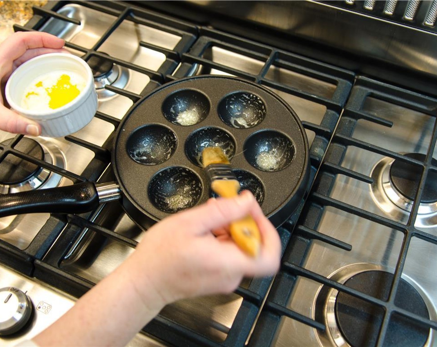 step 10 Brush each aebleskiver cup with melted butter.