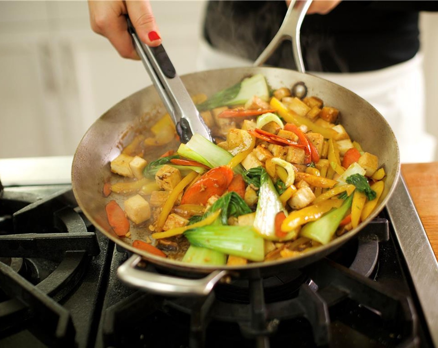 step 12 Add bok choy and continue to cook for one minute. Remove pan from heat and you're ready to plate.