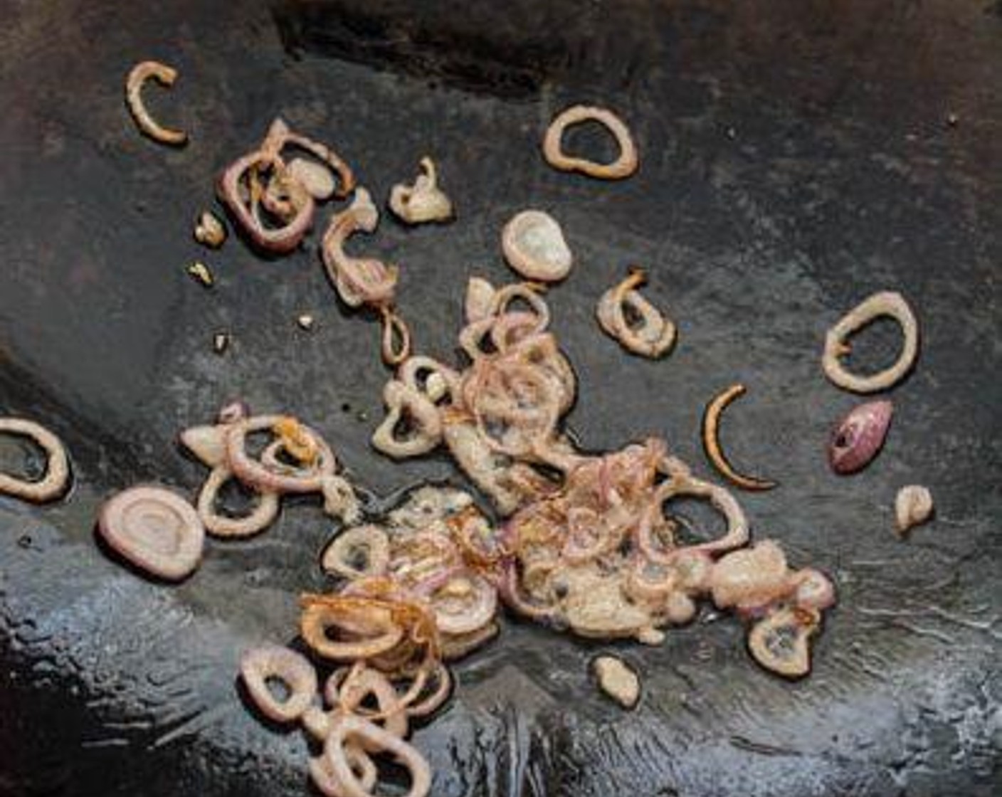 step 4 Heat Cooking Oil (2 Tbsp) in a wok over medium-high heat. Add Shallots (2) to wok.