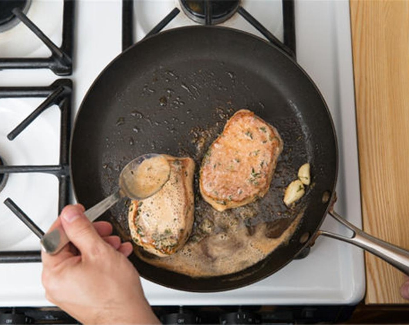 step 6 Pat the Boneless, Center-Cut Pork Chops (2) dry with paper towels; season with Salt (to taste) and Ground Black Pepper (to taste) on both sides. In the same pan used to cook the carrots, heat Olive Oil (1/2 Tbsp) on medium-high until hot. Add the seasoned pork; cook 4 to 6 minutes on the first side.