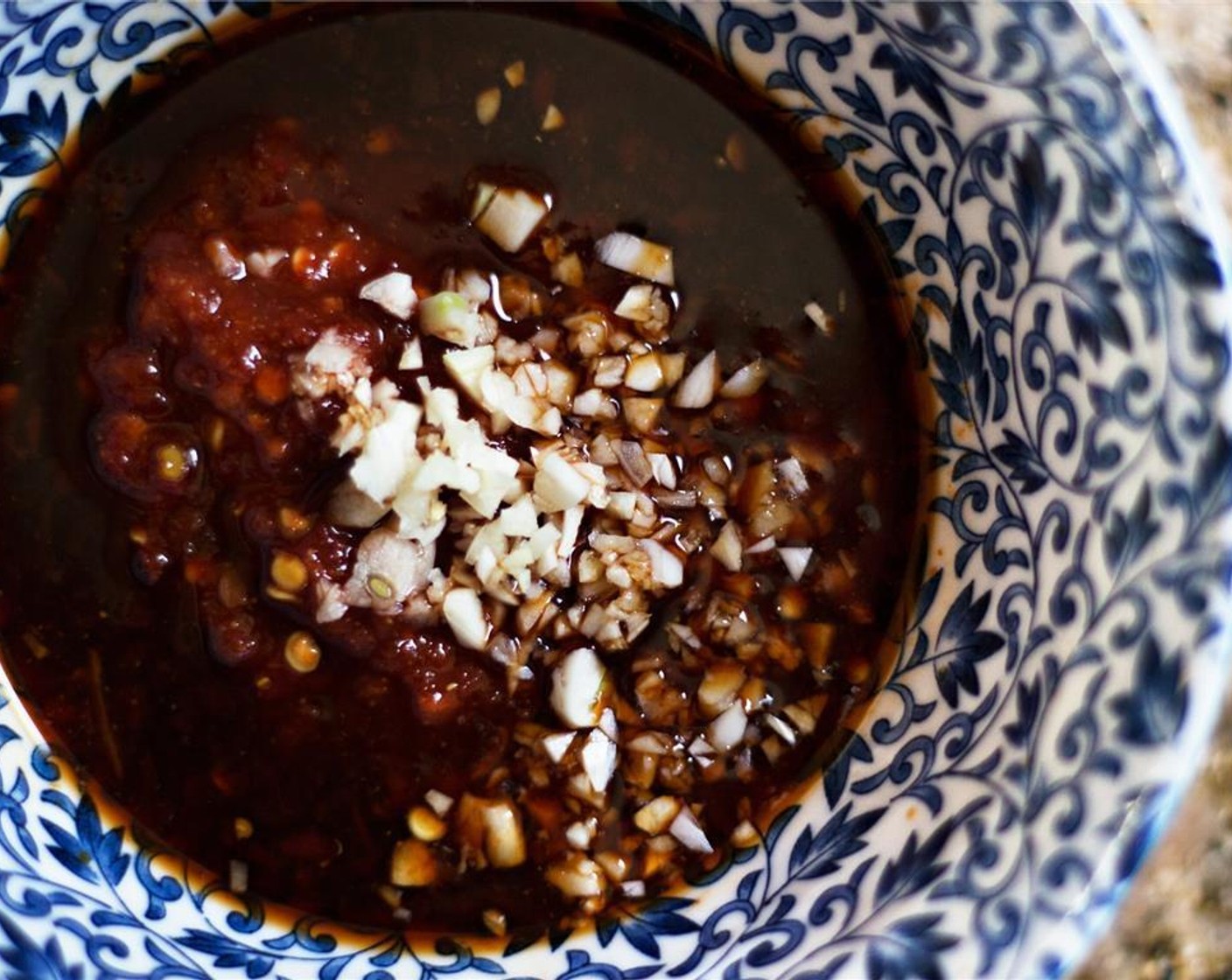 step 4 Mix the Garlic (2 cloves), Sambal (1 tsp), Soy Sauce (1 tsp), Fresh Ginger (1 tsp) and the juice from Lemon (1) in a bowl.