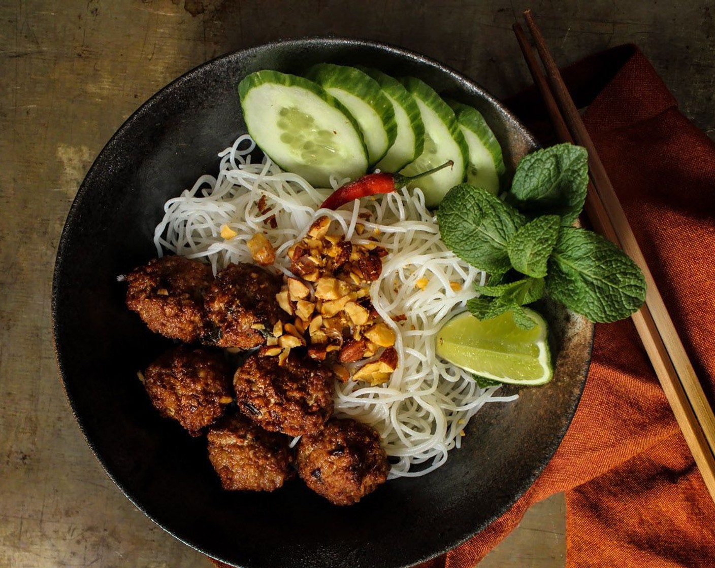 step 8 As a Noodle Bowl – Boil some vermicelli noodles and add the noodles and meatballs into the bowl. Garnish it with mint, cucumbers, a wedge of lime for some zing. Top it with crushed nuts for a bit of crunch. Sauces: Sriracha, Nuoc Cham (sweet, sour and salty fish sauce dressing), or thinned out hoisin sauce.