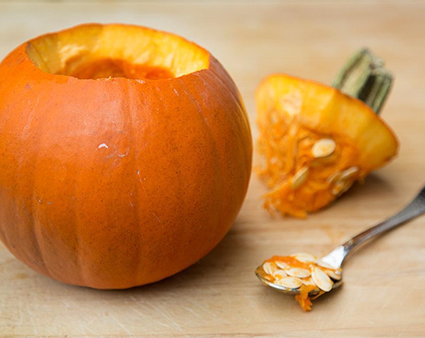 step 6 When shell has par-cooked, turn the oven up to 375 degrees F (190 degrees C) for the Sugar Pumpkin (1). Remove the stem from the pumpkin and scrape out the insides, discarding the seeds.