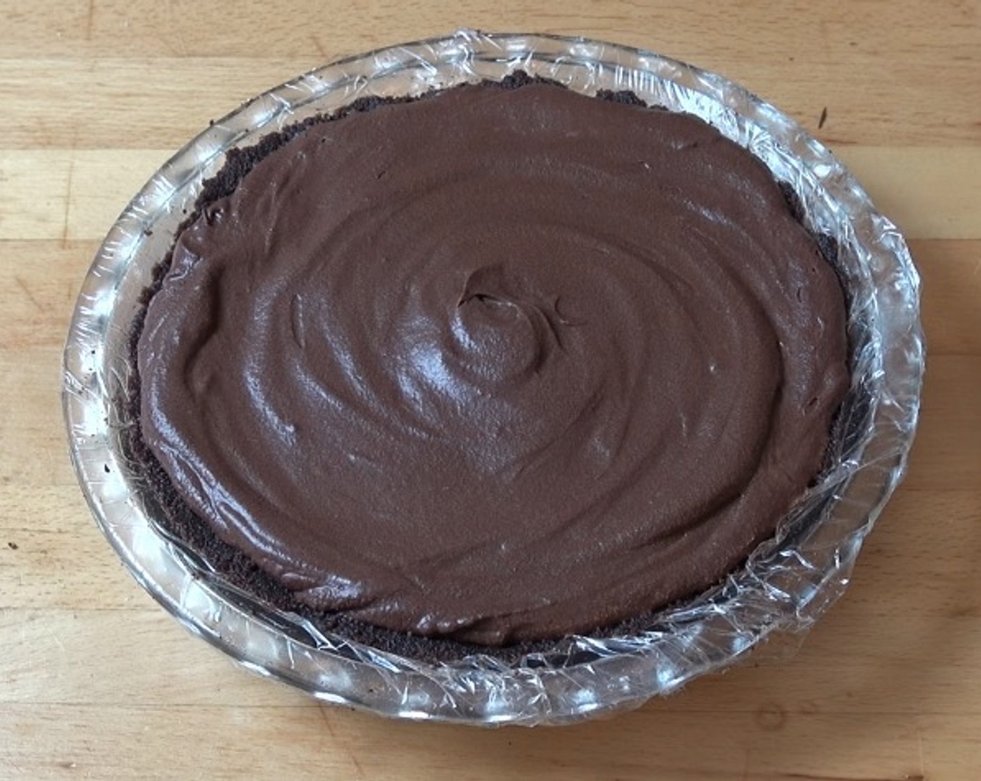 step 7 Pour the chocolate mixture onto the pie crust, smoothing the top. Place into fridge to chill for at least 8 hours.