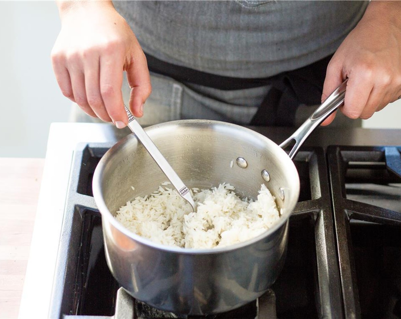 step 9 Pour one cup of water into a small saucepan over medium high heat. Add the Jasmine Rice (2/3 cup) stir, and bring to a boil.