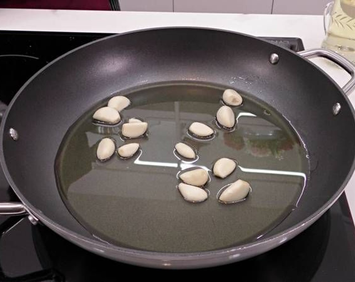 step 1 Peel all the Garlic (1 head) and fry in a pan with enough Olive Oil (as needed) to cover the bottom.