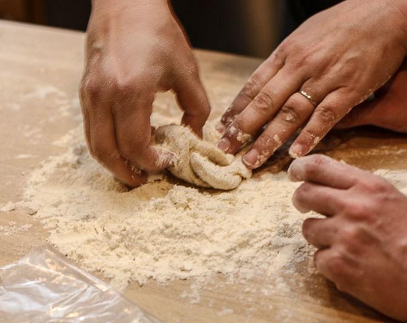 step 3 As the dough begins to mix and form, fold the dough over toward you, then push it with the heel of your hand away from you. Repeat this 10-12 times until the dough starts to get firm. Continue until all flour is incorporated into the egg and dough is completely formed.