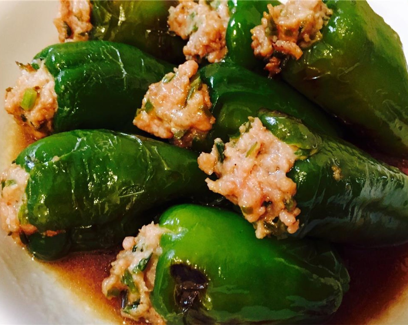 step 9 Plate the stuffed peppers, ladling over the juice from inside the pressure cooker. Enjoy with rice and other dishes.