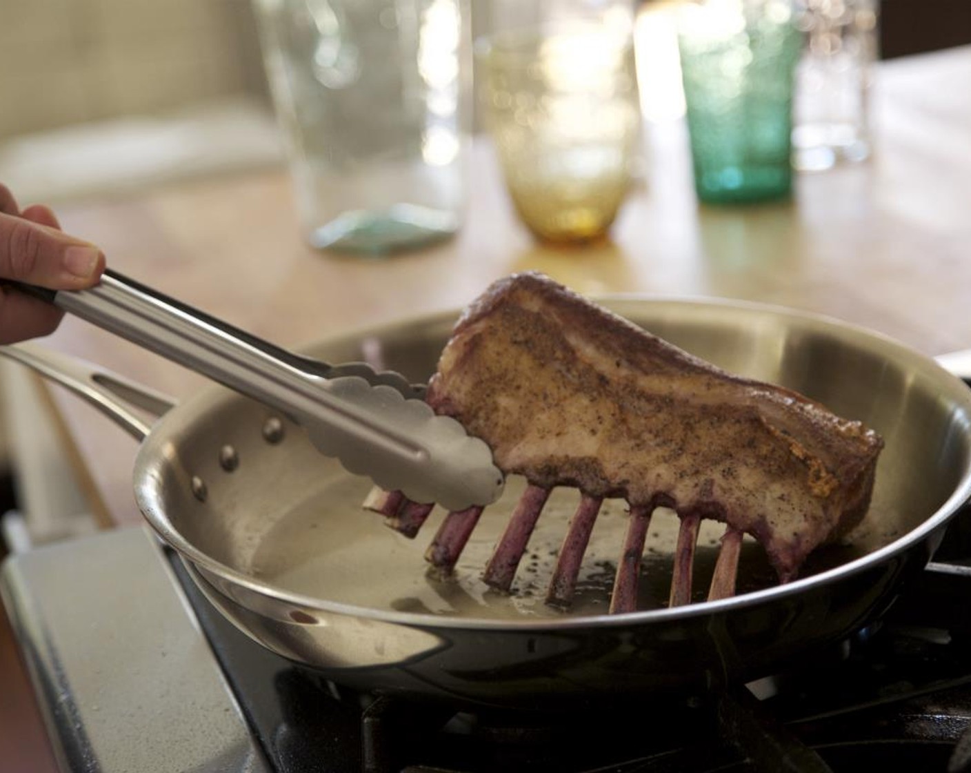 step 8 Heat Olive Oil (1 Tbsp) in a large sauté pan over medium-high heat. When hot, sear lamb (fat side down) for 3 minutes.