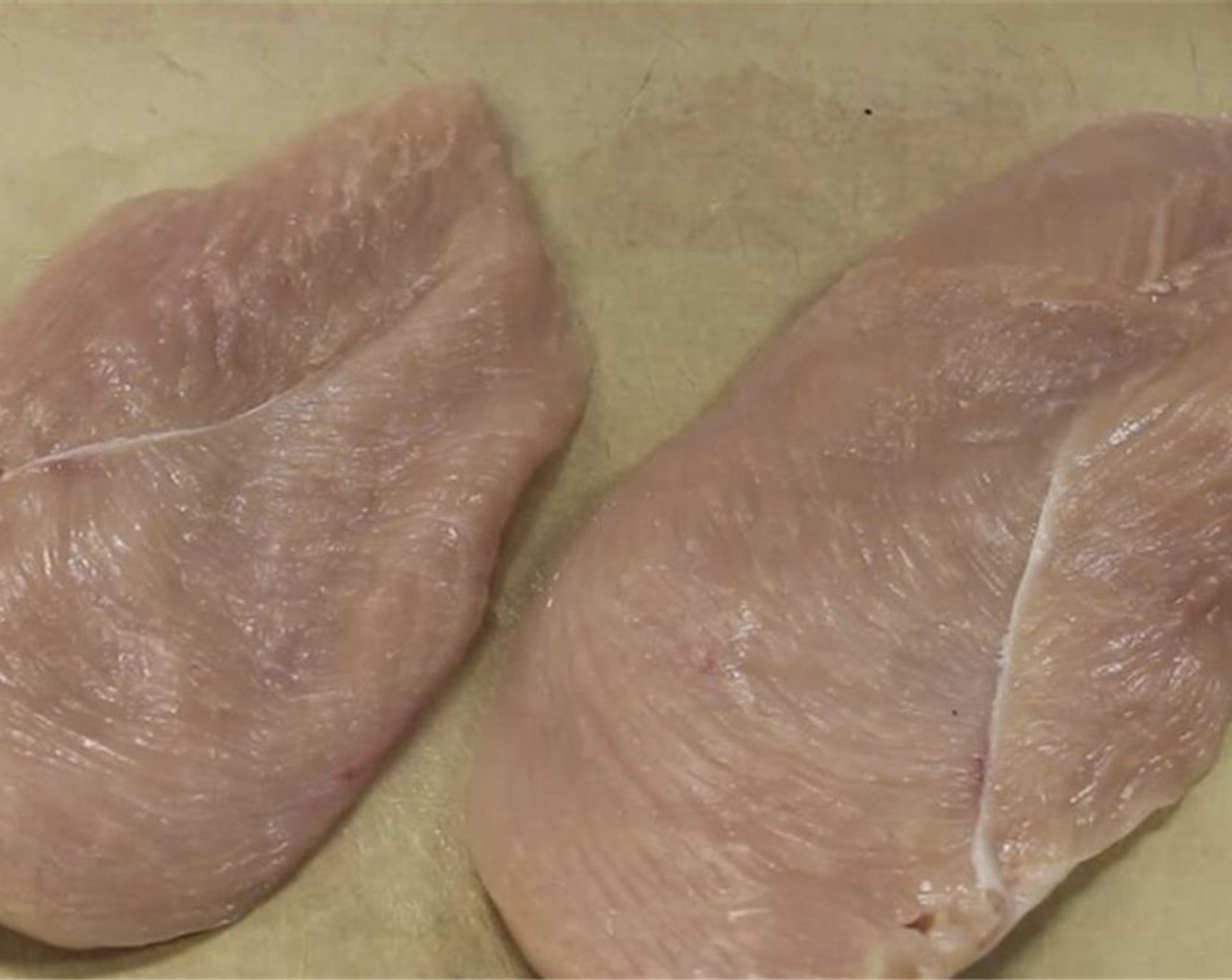 step 2 Cut Chicken Breast (1 lb) in half. Cut each half into 4 strips. Cut the strips into 1-inch cubes.