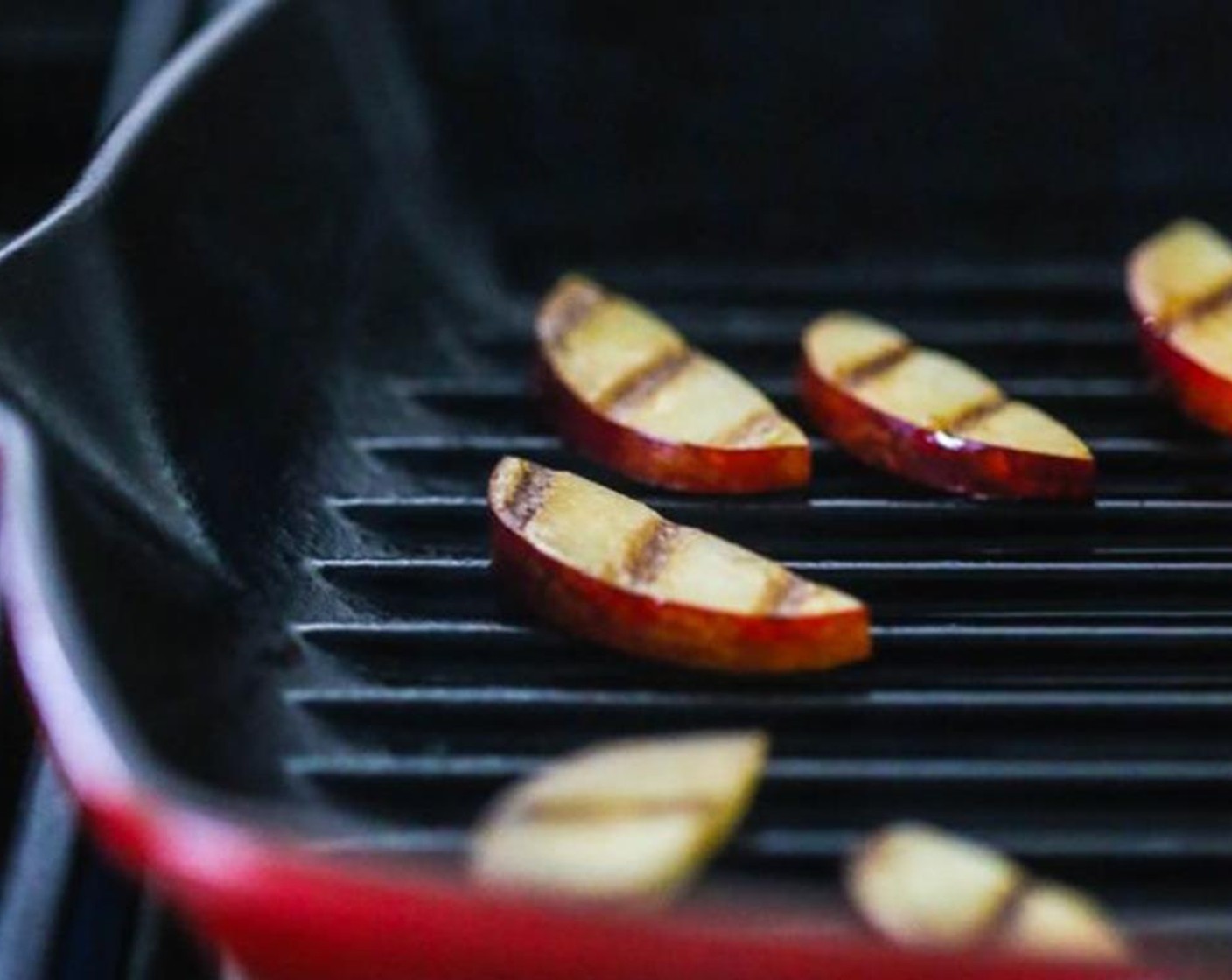 step 3 Grill the sliced plum, nectarine, apricot, and peach slices for about three to four minutes on each side or until grill marks appear.