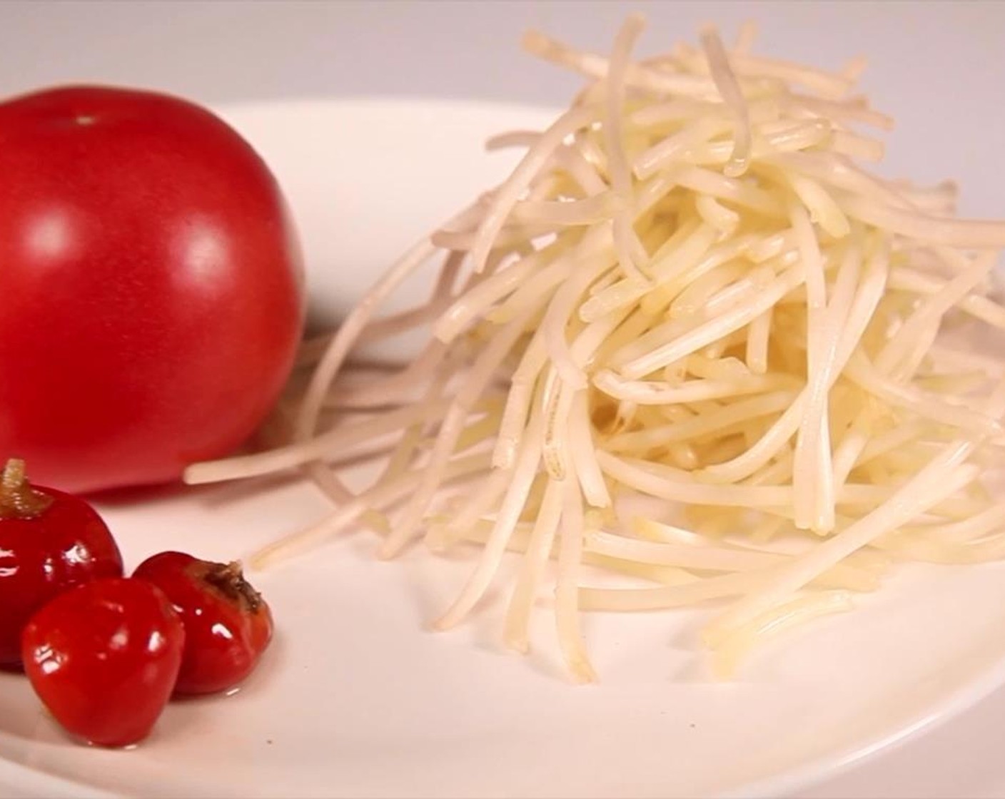 step 1 Cut the Kumquat (2 1/2 Tbsp), Tomatoes (2 1/2 Tbsp), Garlic (1 1/2 cloves), and Yellow Onions (3 Tbsp).