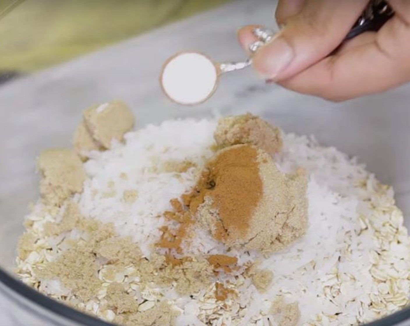 step 2 Pour Old Fashioned Rolled Oats (2 cups), Sweetened Coconut Flakes (1/2 cup), Brown Sugar (3 Tbsp), Ground Cinnamon (3/4 tsp) and Salt (3/4 tsp) into a bowl and stir to combine.