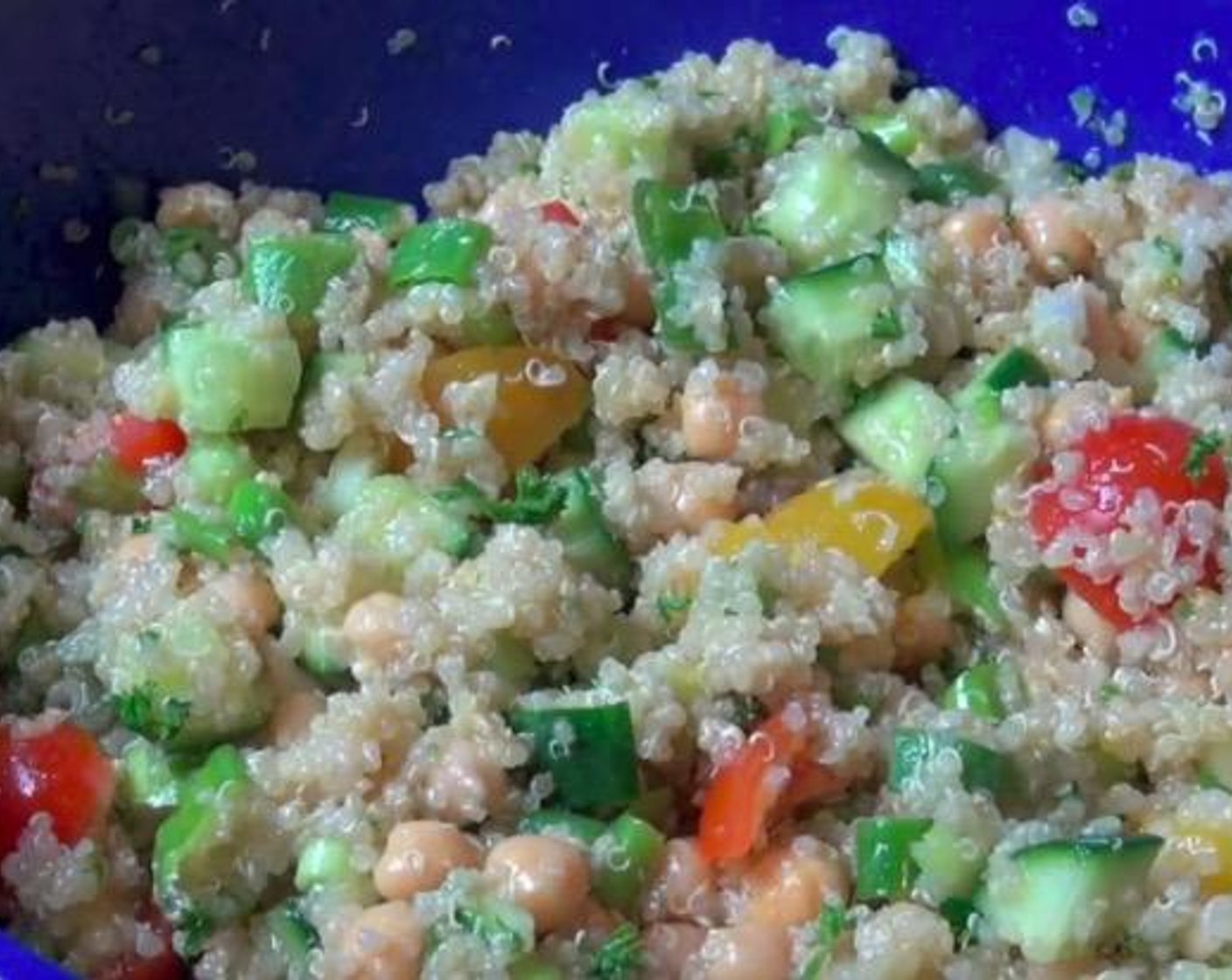 step 3 To the mixing bowl with the quinoa, add Cherry Tomatoes (1 2/3 cups), Cucumber (1), Chickpeas (1 can), Scallion (1 bunch), and Fresh Parsley (3 Tbsp). Toss together. Drizzle the dressing over top and toss again.