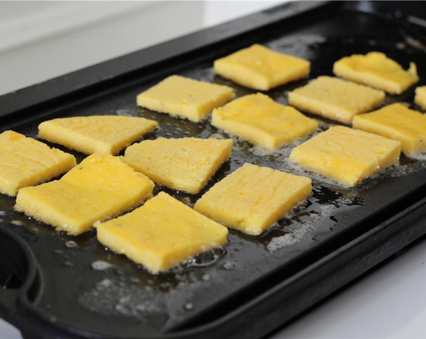 step 19 Fry the polenta squares for 5 minutes. Don't disturb them while they brown!