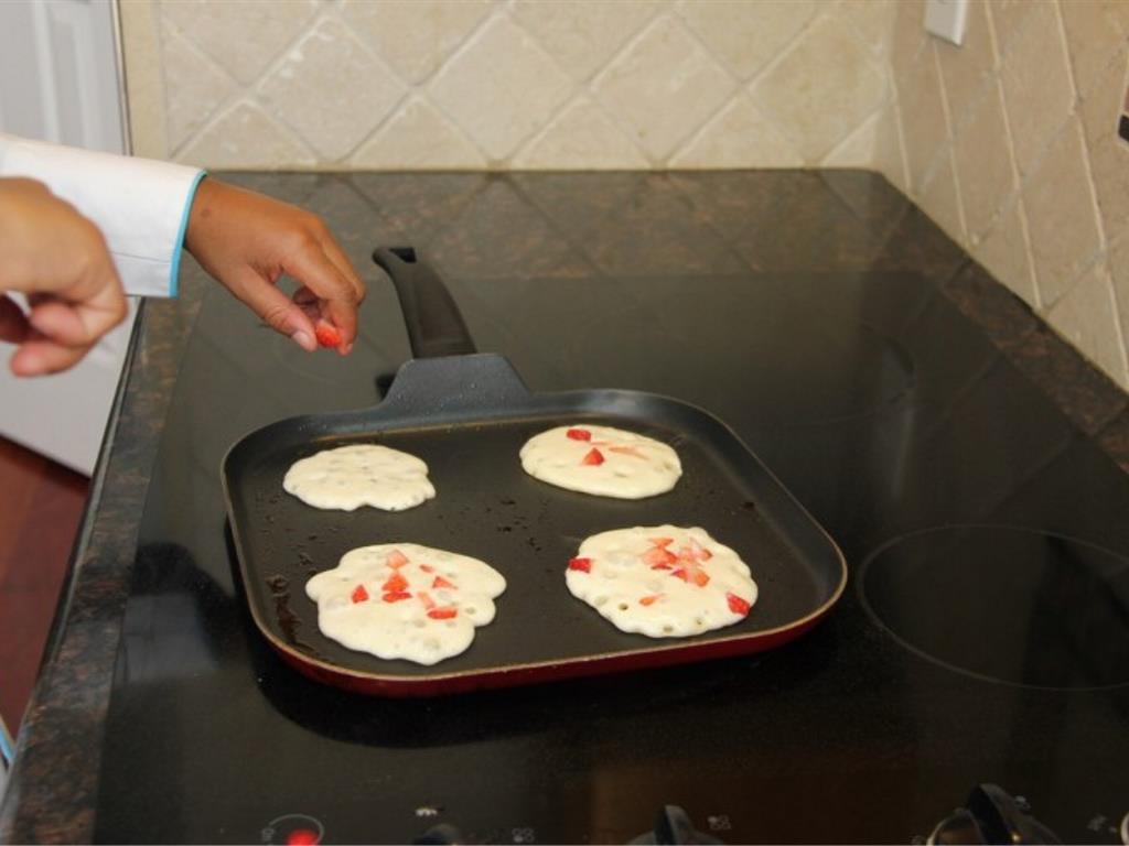 Step 5 of Three Layer Strawberry Pancakes Recipe: You can add strawberries to the batter if you like.