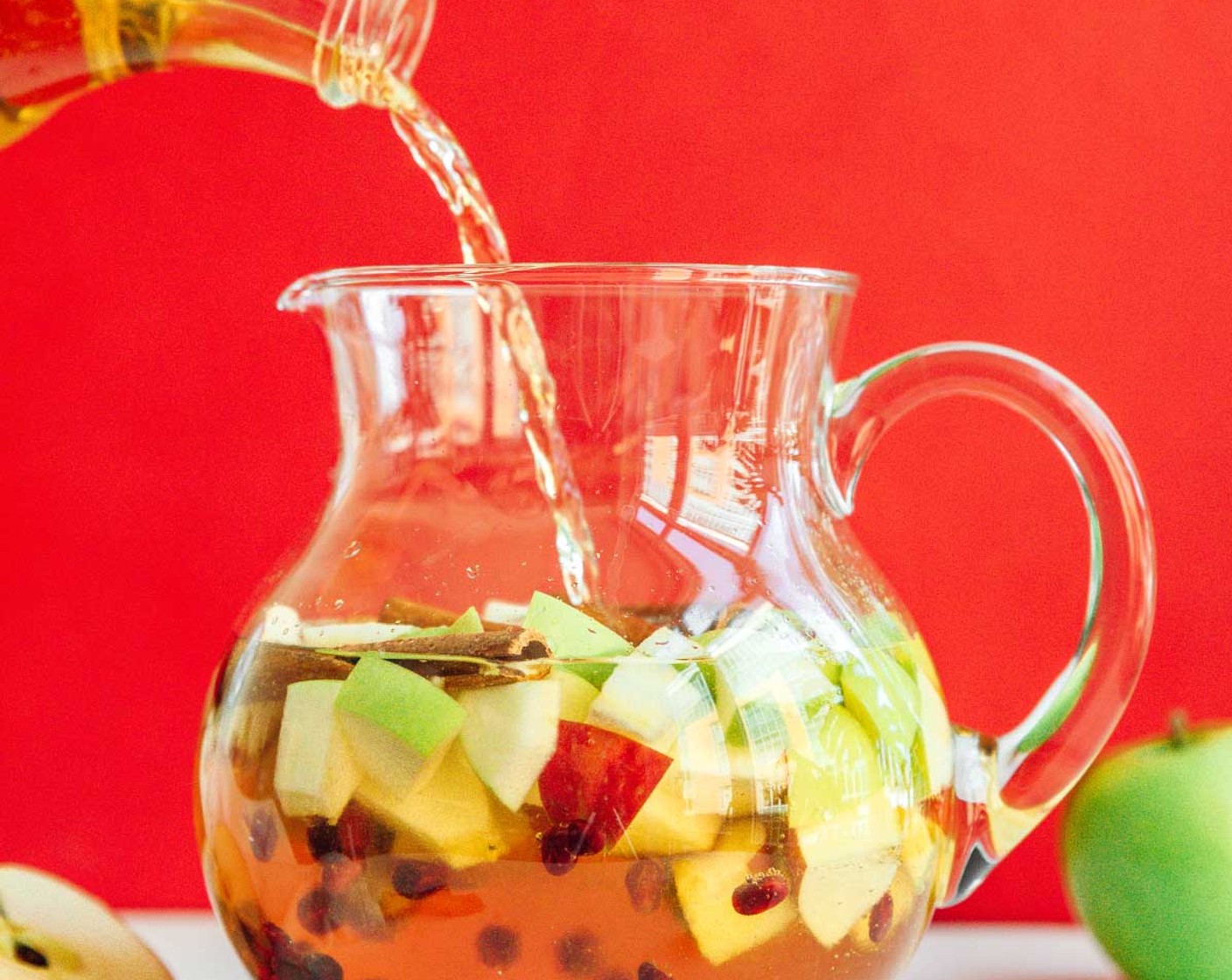 step 1 In a large pitcher, combine Apples (2), Pomegranate Seeds (1/2 cup), Cinnamon Sticks (4), Dry White Wine (1 bottle), Apple Cider (3 cups), and Apricot Brandy (1/4 cup). If you have time, set the pitcher in the fridge for a few hours to allow flavors to blend.