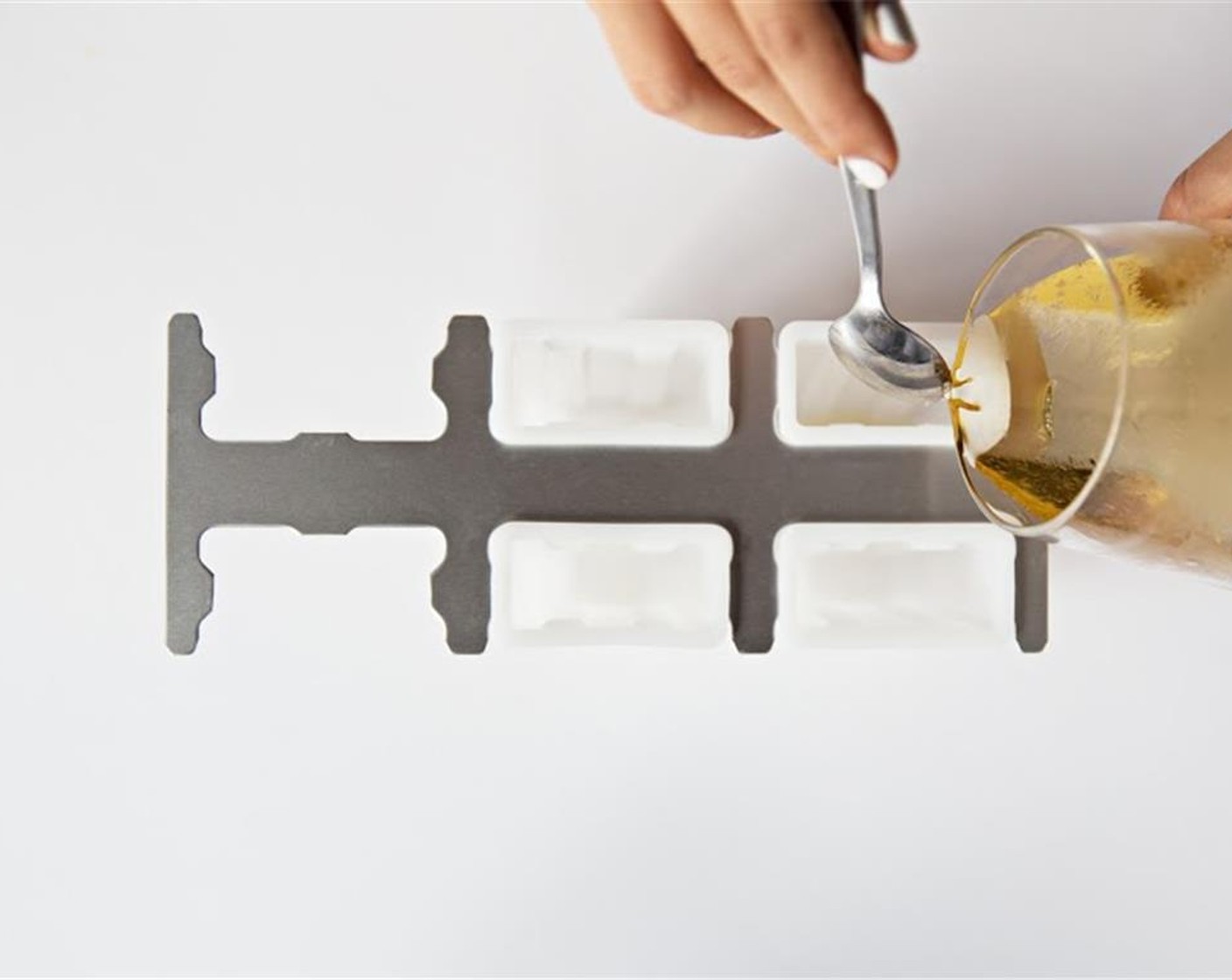 step 2 Pour Ginger Ale (1 can) into the popsicle molds.