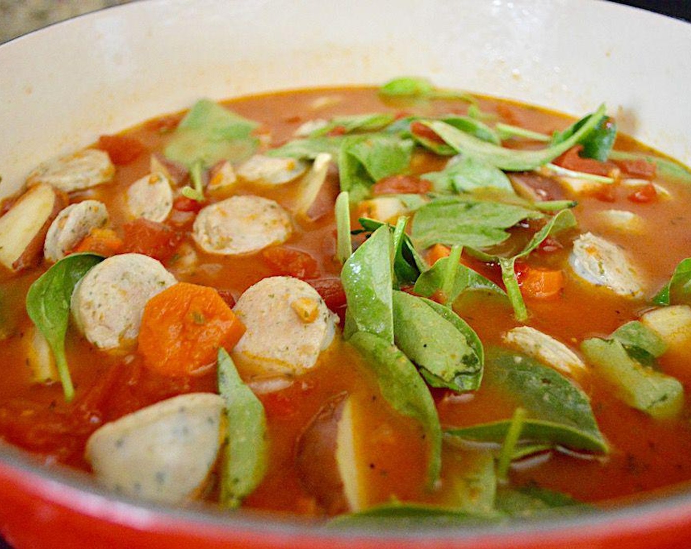 step 5 Pour in Chicken Stock (4 cups), Diced Tomatoes (1 can), Fresh Baby Spinach (1 cup), and Fresh Basil (1/4 cup) and give everything a big stir.