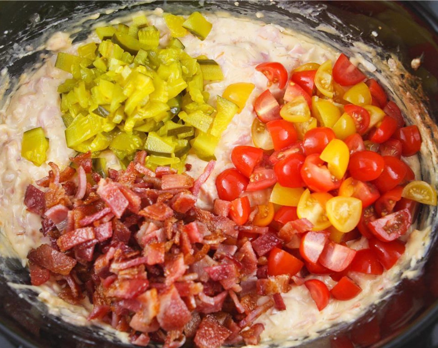 step 4 Add the bacon pieces, tomatoes and pickles. Stir and heat for 10 additional minutes on low heat.