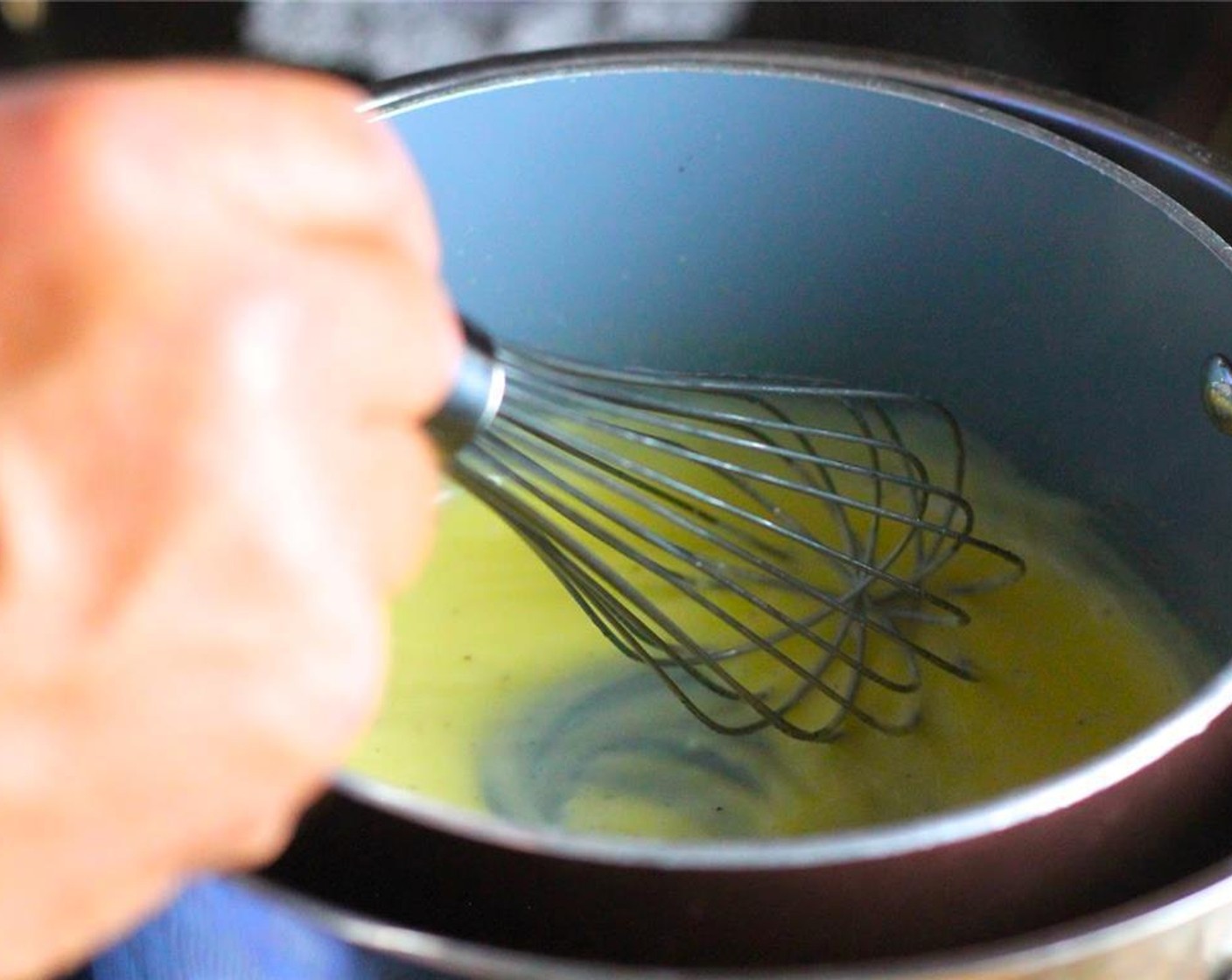 step 7 Stir constantly until the mixture begins to thicken. If you cook this on too high of heat, your eggs will begin to curdle or scramble, so be sure to keep the water slightly under a boil, and stir continuously.