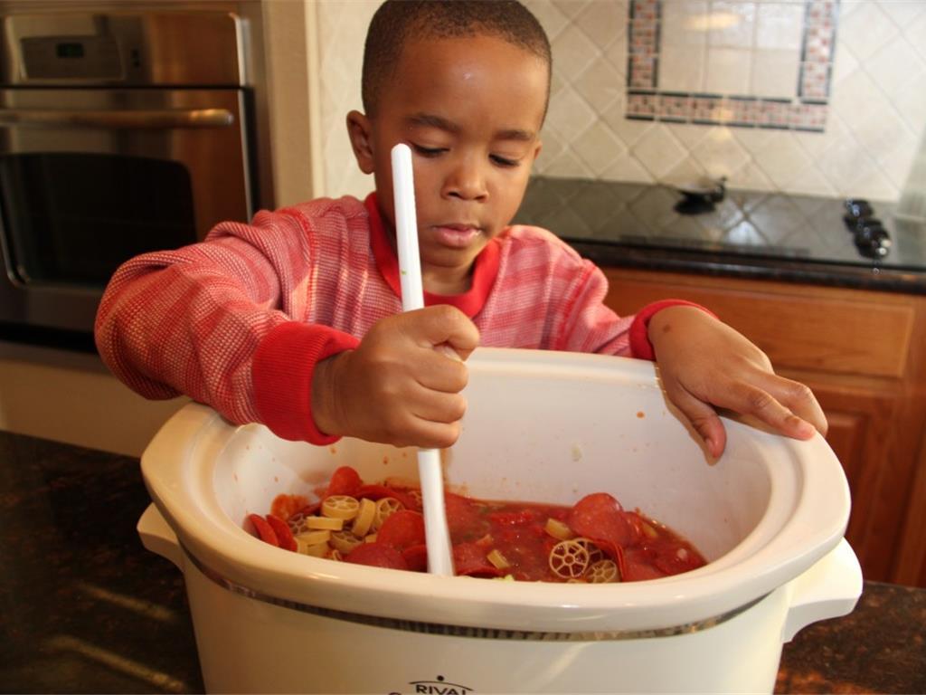 Step 8 of Pizza in a Bowl Recipe: Stir everything together.