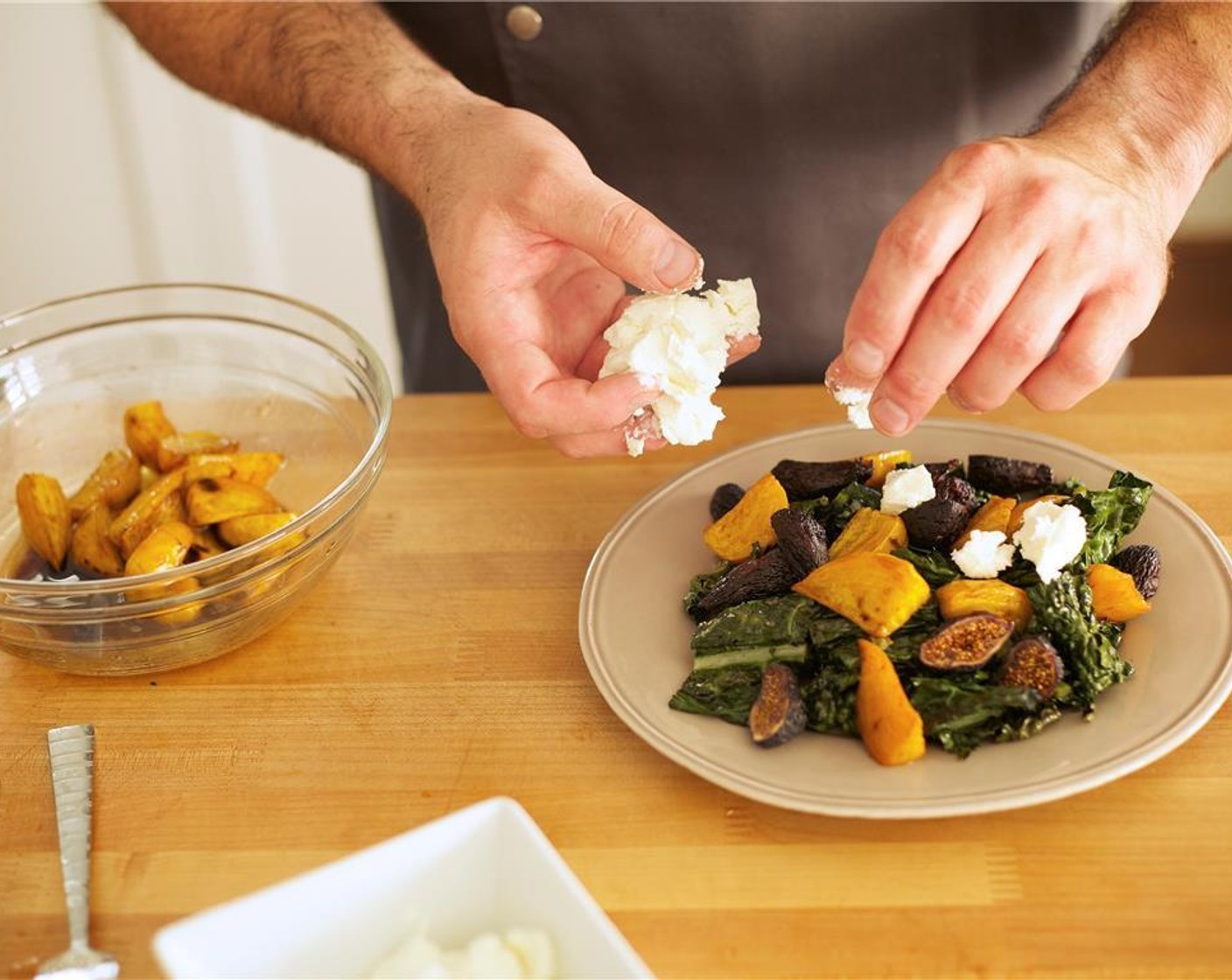 step 9 Divide the dressed kale between two plates. Layer beets over kale. Divide figs between the plates and layer over kale and beets, being sure to keep all ingredients visible. Break off chunks of Goat Cheese (1/2 cup) evenly between the two plates.