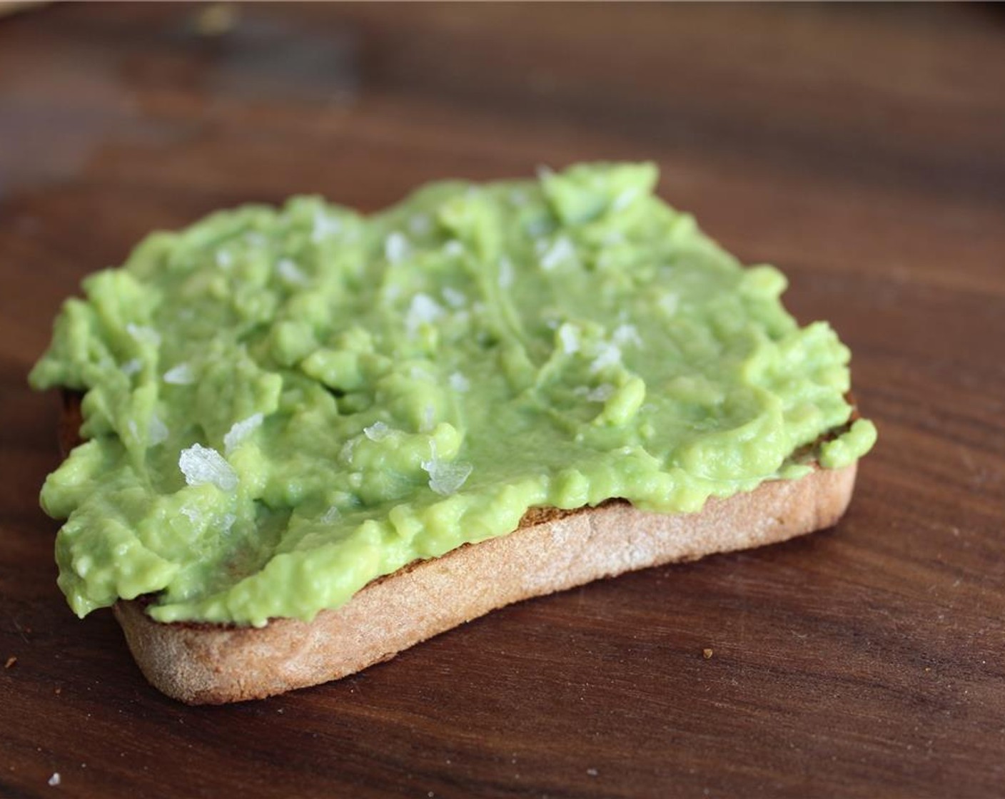 step 3 Spread a layer of mashed avocado over toast, and top with a little Sea Salt Flakes (to taste).